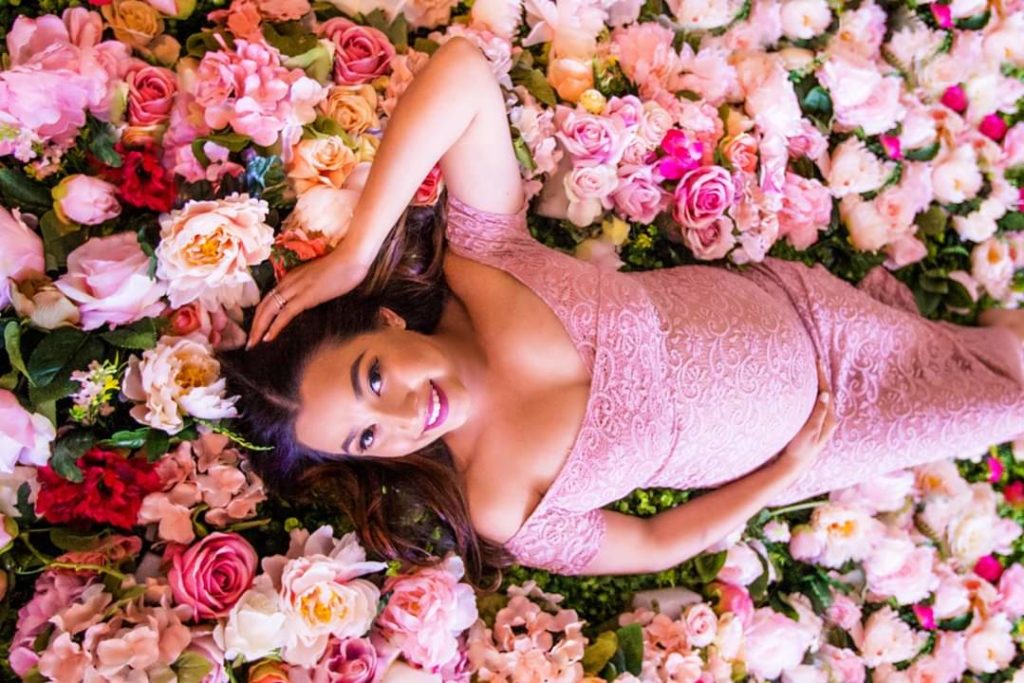 maternity picture in a bathtub with flowers